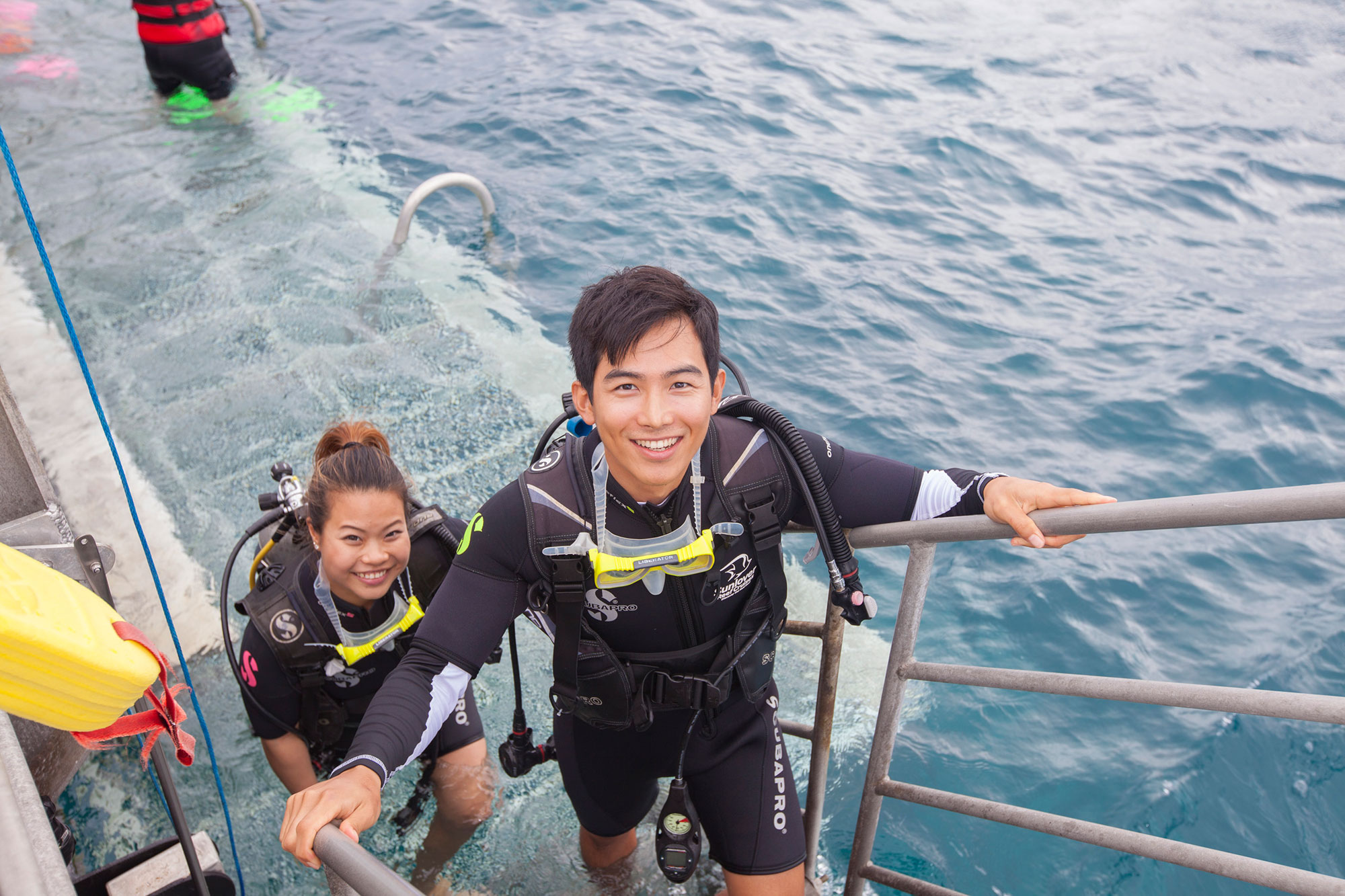 two happy people on pontoon in Cairns Great Barrier Reef